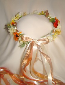 Silk fall wild flowersand leaves grace this pretty old fashioned wreath.
