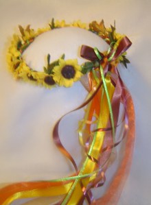 Silk sunflowers and fall leaves grace this wreath.