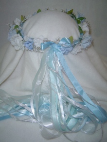 Soothing light blue and soft white roses accented, with shimmering silver.