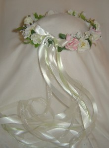 Beautiful soft ivory and pale pink flowers and ribbons mixed with a very soft green.