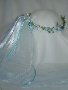 Kya light blue and white wreath with white veil.
